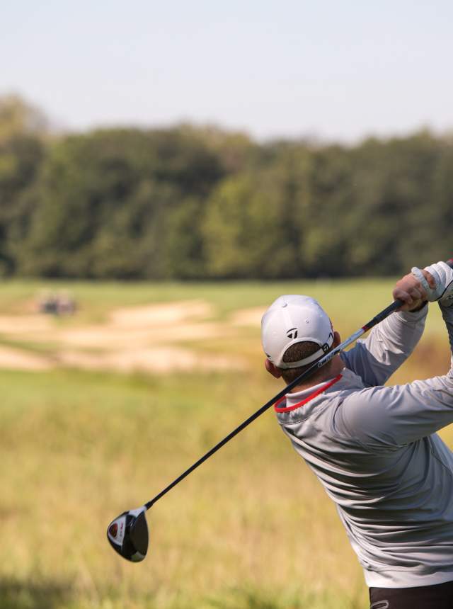 Golfer swinging on a fairway at the Prairie View Golf Club course. Photo by: Zach Dobson