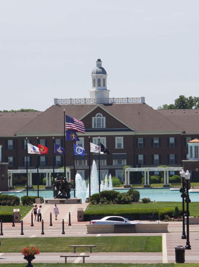 Carmel City Center building with a fountain out front on a sunny day.