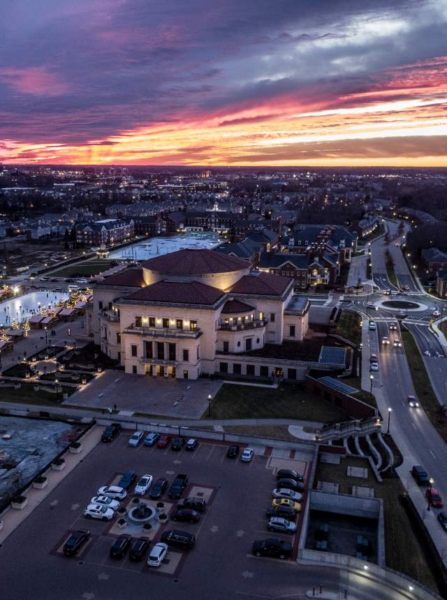 Nighttime aerial view of the Palladium at the Center for the Performing Arts and roundabout.