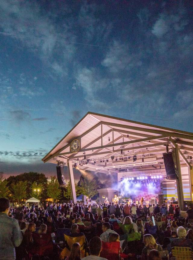 A Crowd Enjoying A Night Concert