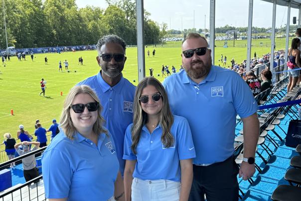 HCSA team members smiling at Colts Training Camp.