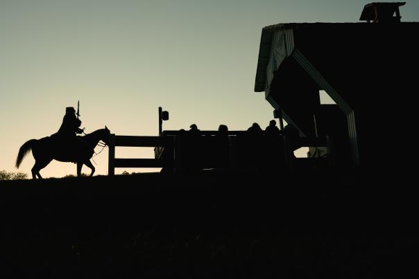 Silhouette of the Headless Horseman riding at sunset during Conner Prairie’s fall festival.