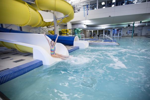 Monon Community Center image showing an indoor pool with a water slide and recreational features.