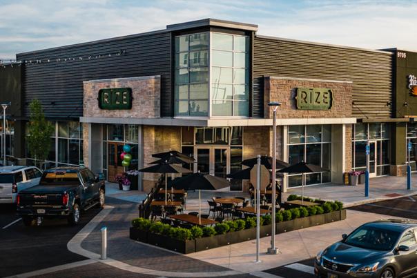 Shopping center in Fishers District with Rize and Rise n' Roll Bakery visible