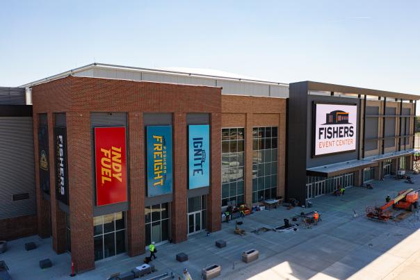 Exterior view of the Fishers Event Center with team banners.