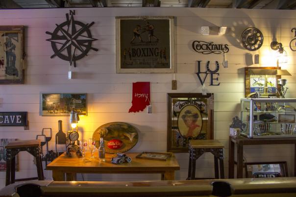 An interior view of various nautical and vintage items hanging on a wall at Mercantile 37.