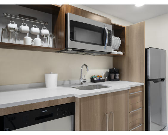 The kitchen in the rooms at Home2 Suites