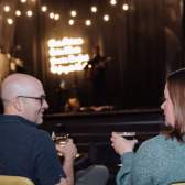 Couple listening to live entertainment at The Prewitt Restaurant + Lounge
