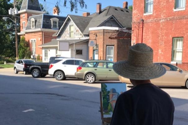 Artist painting the Hendricks County Historical Museum