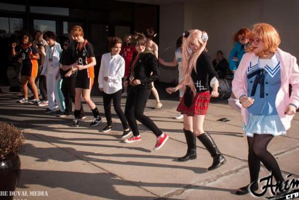 Attendees forming a dance line at Anime Crossroads.