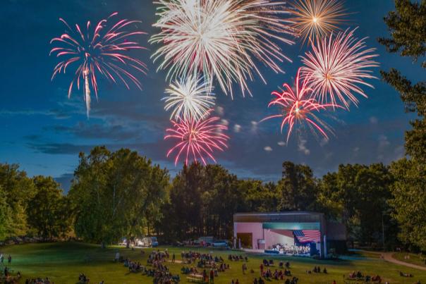 People on the lawn at Hummel Park watch fireworks on July 4.