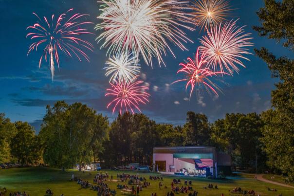 People on the lawn at Hummel Park watch fireworks on July 4.