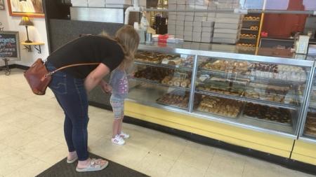 Customers have a hard time choosing just one treat in the bakery case at Hilligoss
