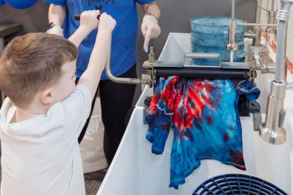 The Tie Dye Lab rinsing a T-shirt