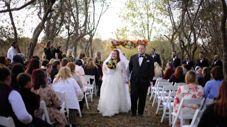 A couple walks down the isle at Martha's Orchard (Laura Leigh Photography).