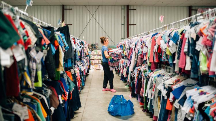 Women Shopping at Here We Grow Again Consignment Sale (Photo Courtesy of Here We Grow Again Facebook Page)