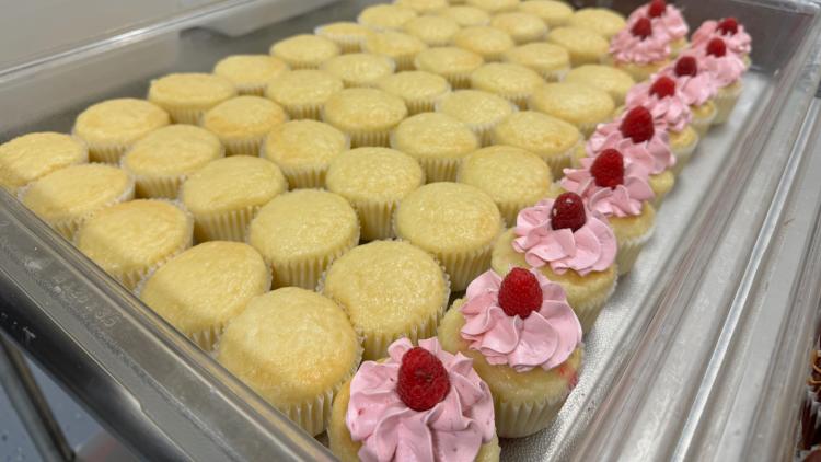 Cupcakes getting iced at Sweet Minis