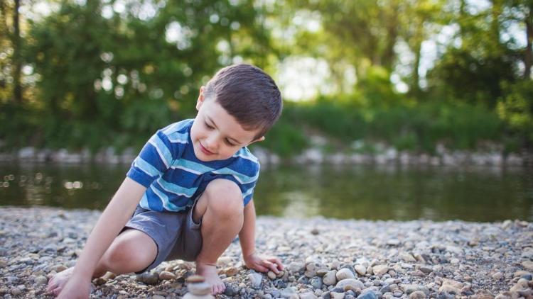 Boy Picking Up Rocks at Hummel Park