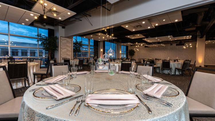 CRG Event Center, featuring floating table centerpieces and elegant lighting.