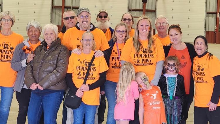 A group of Pumpkins and Paws volunteers.
