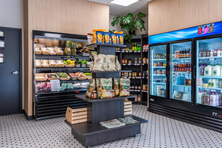Vegetables, sauces, drinks and snacks in the small grocery area at Roots Market + Eatery in Plainfield