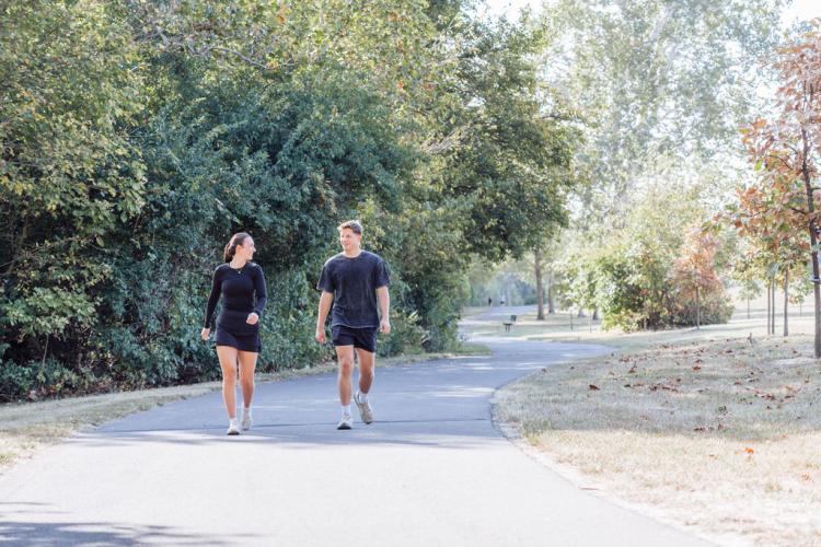 Couple Walking on Park Trail