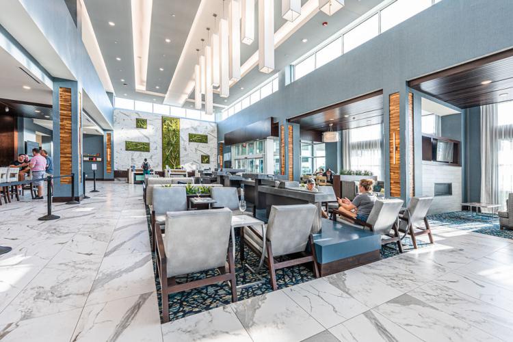 The lobby inside the Embassy Suites By Hilton Indianapolis Airport Plainfield Hotel