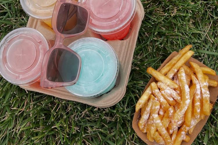 A drink carrier featuring 4 of Zo-Bot's Sodas & Fries dirty sodas and their famous fries