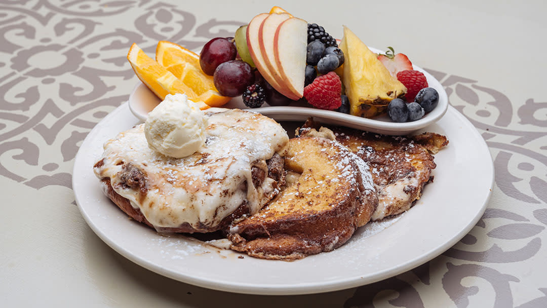 Cinnamon roll French toast breakfast at Bread Basket Cafe & Bakery