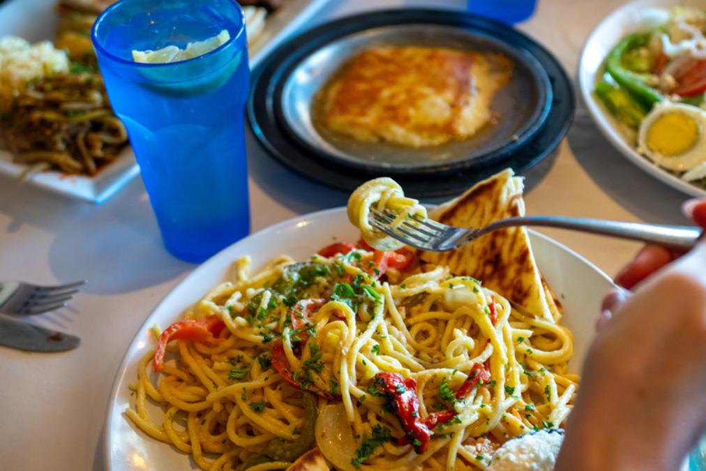 Twirling pasta on fork and Opa in Avon, Indiana.