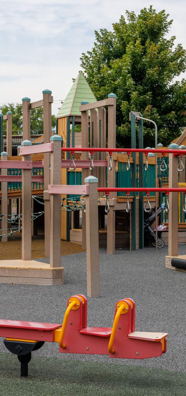 A playground with wooden play equipment