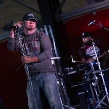 A man sings on stage.