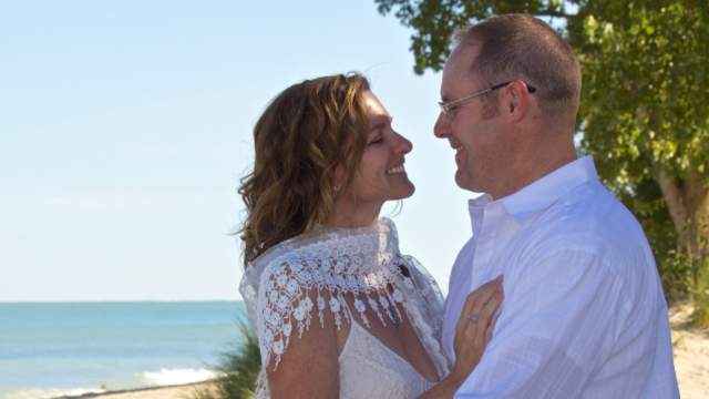 Two people embracing at the dunes
