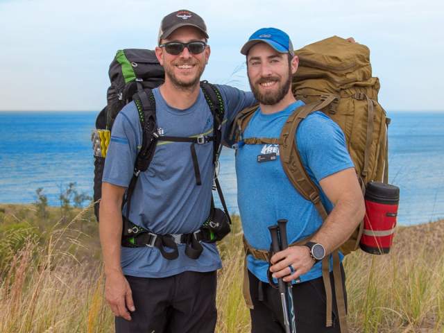 Two backpackers posing for photo