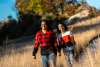 A mother and child hike in the fall.