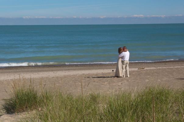 A couple kissing on the beach
