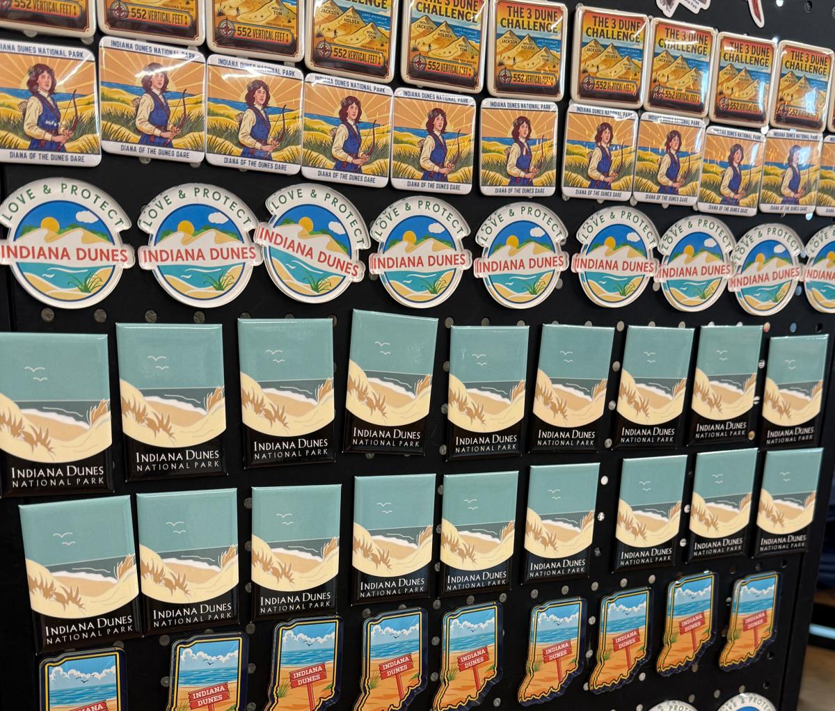 Display of Indiana Dunes magnets for sale at Beaches & Beyond Gift Shop inside the Indiana Dunes Visitor Center.