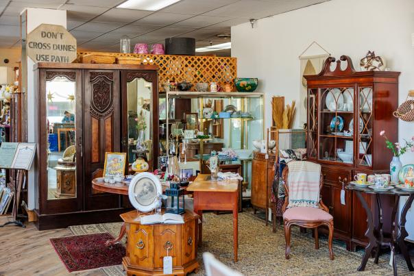 The interior of Yesterday's Treasures antique shop in Chesterton, Indiana, packed with vintage furniture, mirrors, clocks, and collectibles on display.