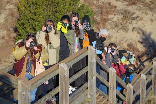 High School Students taking pictures on a trail
