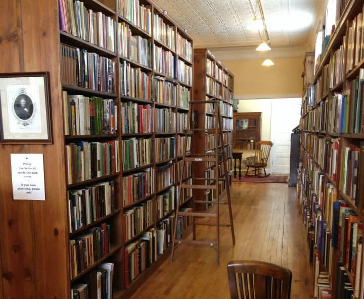 An aisle of bookshelves in an antique bookstore