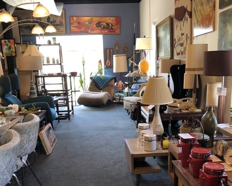 A vintage shop is filled with vintage furniture