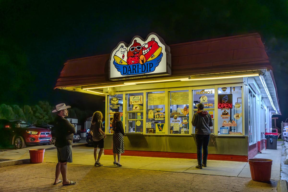 Customers waiting at the walk-up window at Dari-Dip on a summer evening in Portage, Indiana.