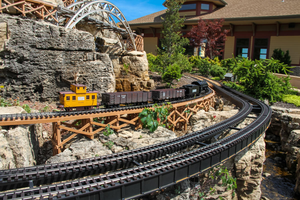 A miniature train display outside