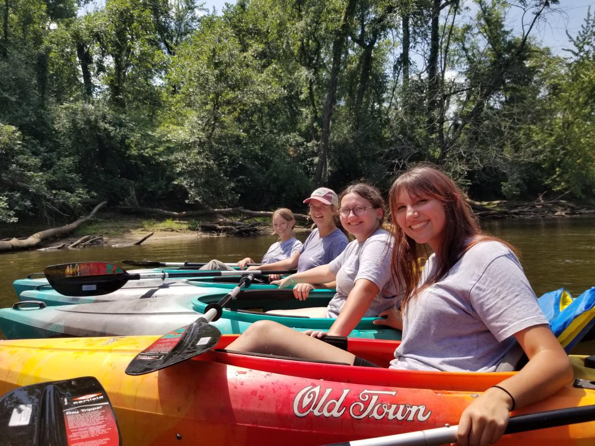 Summer 2023 Interns floating on the Kankakee River