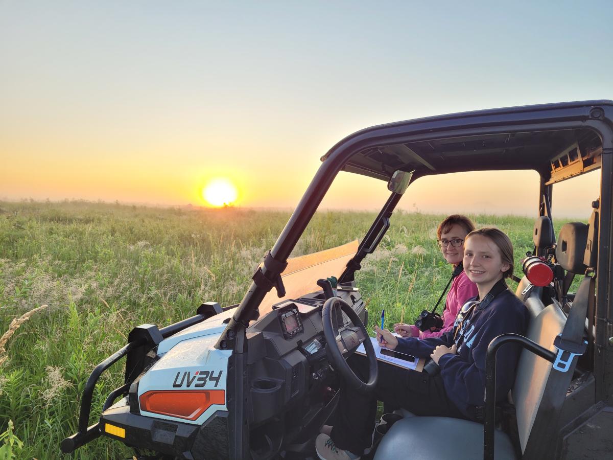 Summer 2024 Intern Dakota Dyer on an early morning bird survery with volunteer Tisha Tolle