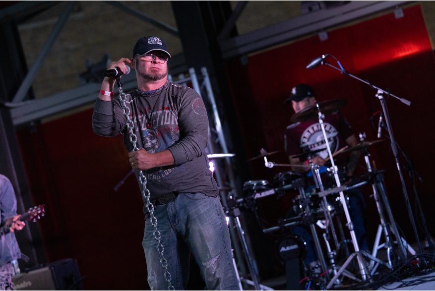 A man sings on stage.
