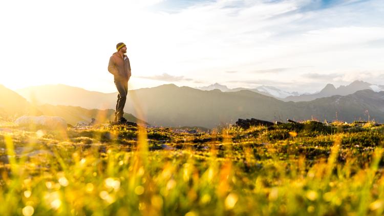 Man standing on hiking trail in Juneau