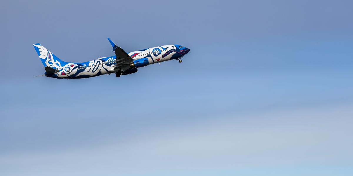 Alaska Airlines plane in Indigenous salmon livery designed by Juneau Indigenous artist, Crystal Worl.