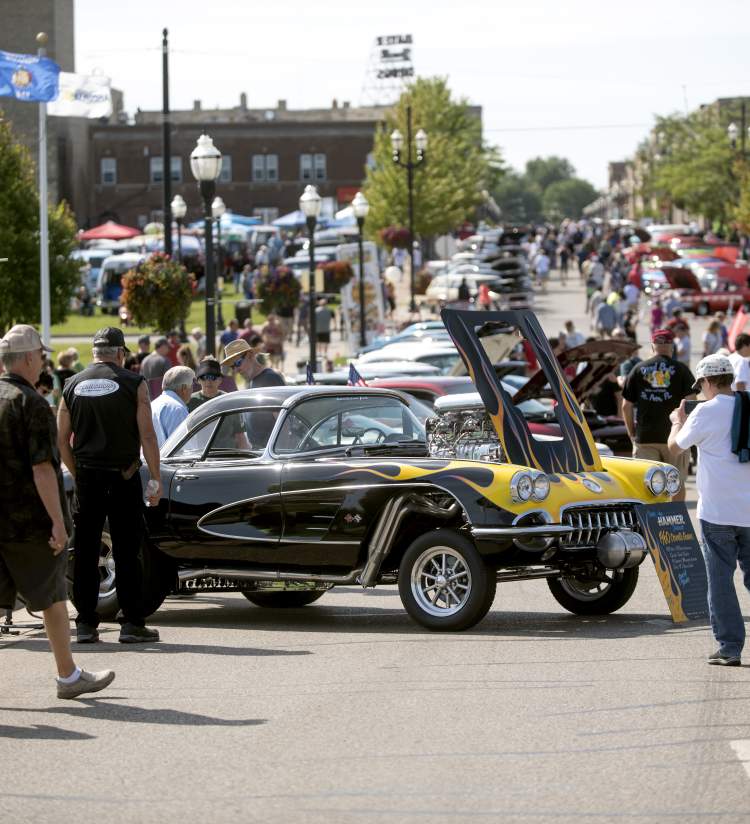 Large crowd surrounding a custom Corvette at the Kenosha Classic Cruise-In