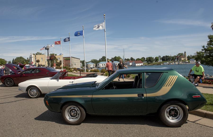 Classic cars displayed beside the Lake Michigan harbor during the Kenosha Classic Cruise-In
